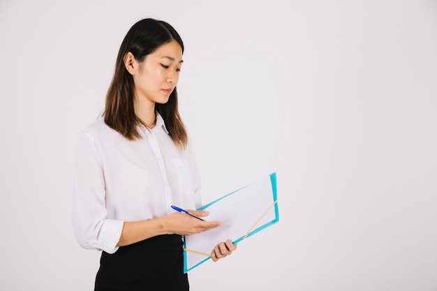 Businesswoman holding clipboard