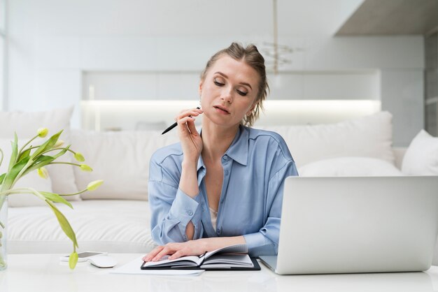 Businesswoman holding pen