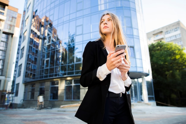 Businesswoman looking away low angle shot