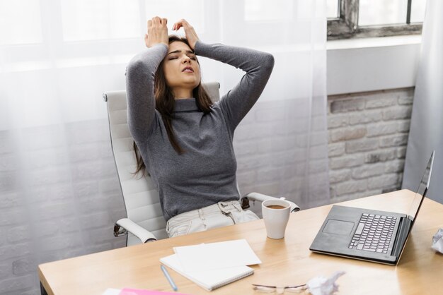 Businesswoman looking frustrated while working from home