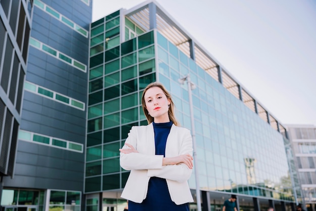 Businesswoman outside with arms crossed