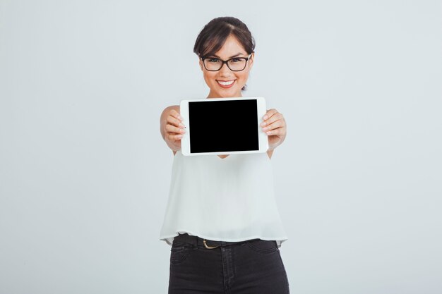 Businesswoman posing with tablet