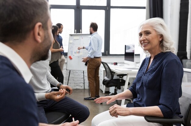 Businesswoman presenting to colleagues at a meeting