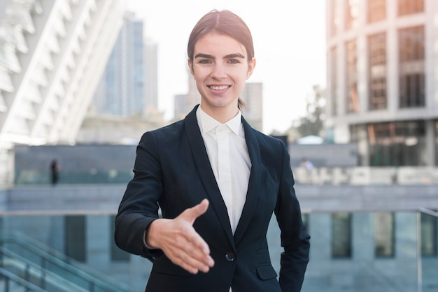 Businesswoman reaching out hand