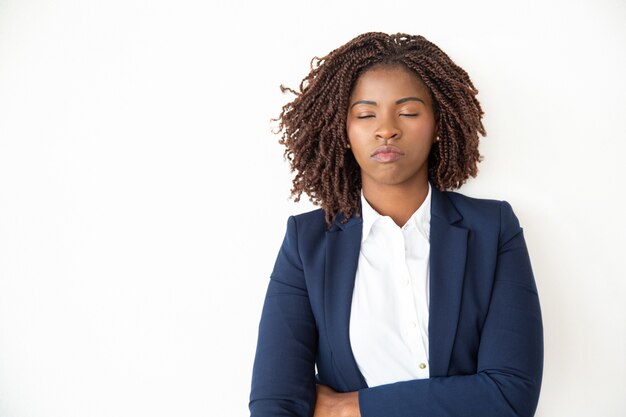 Businesswoman relaxing with closed eyes