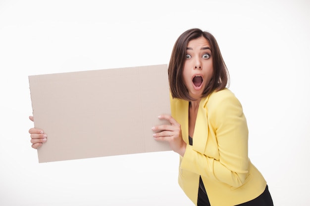 Businesswoman showing blank board