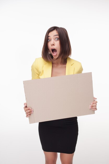 Businesswoman showing board or banner with copy space on white background