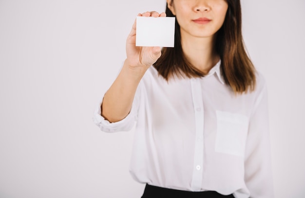 Free photo businesswoman showing business card