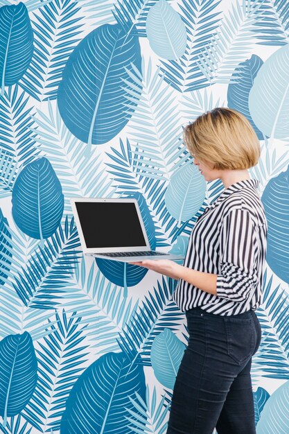 Businesswoman showing laptop