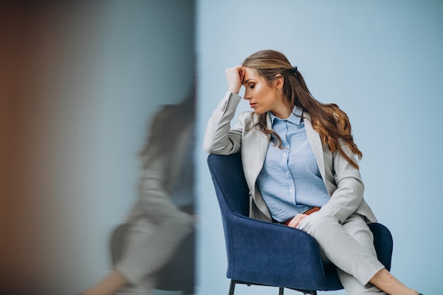 Businesswoman sitting in chair at an office