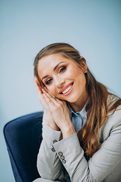 Businesswoman sitting in chair at an office