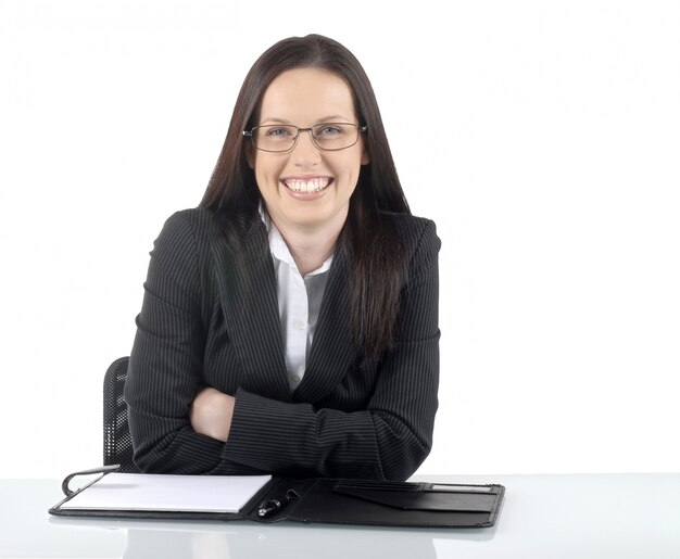 Free photo businesswoman sitting at desk