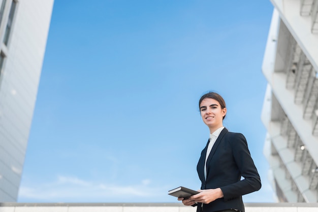 Businesswoman on sky background