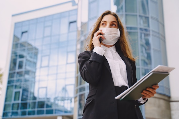 Businesswoman standing outdoors in city office building 