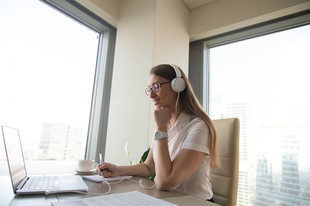 Businesswoman takes part in online meeting