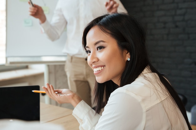 Businesswoman talking with colleague