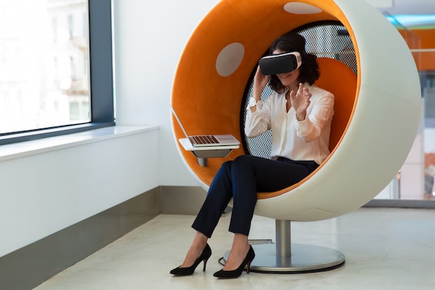 Businesswoman testing VR software in studio