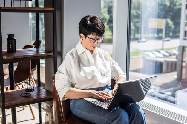 Businesswoman typing and working indoors