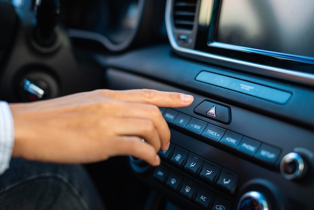 Businesswoman using the dashboard of her car