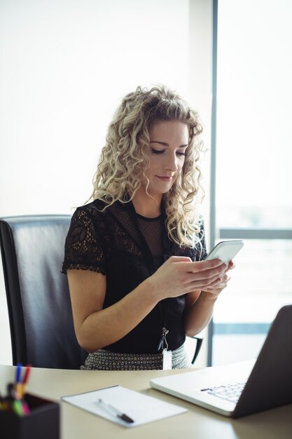 Businesswoman using mobile phone