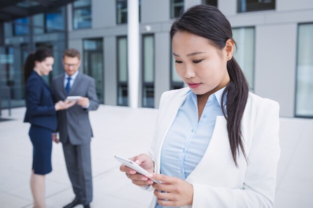 Businesswoman using mobile phone