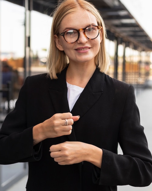 Businesswoman using sign language outdoors at work