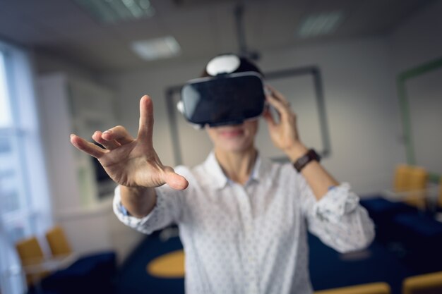 Businesswoman using virtual reality headset