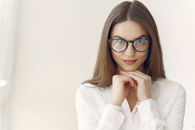 Businesswoman in a white shirt sitting in the office