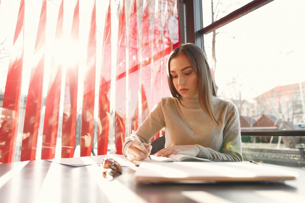 Businesswoman working in a cafe