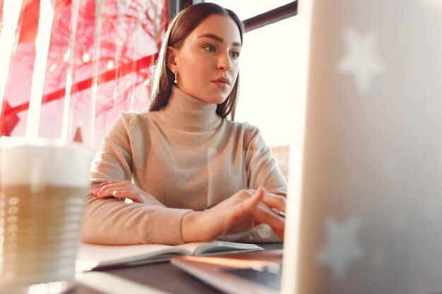 Businesswoman working in a cafe