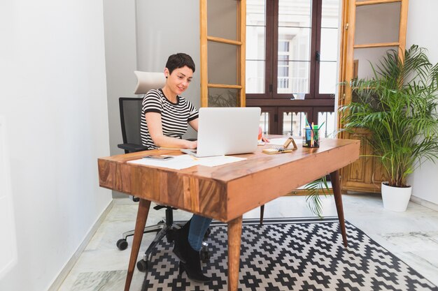 Businesswoman working in her modern office