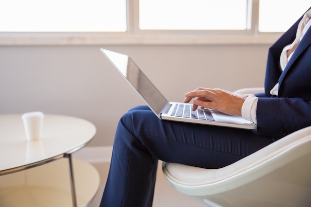 Businesswoman working in office lounge Free Photo