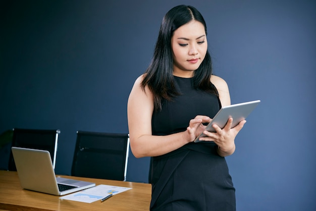 Businesswoman working on tablet