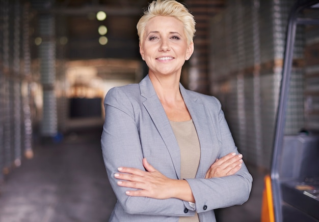 Businesswoman working in warehouse