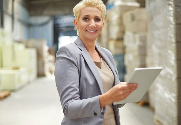 Businesswoman working in warehouse