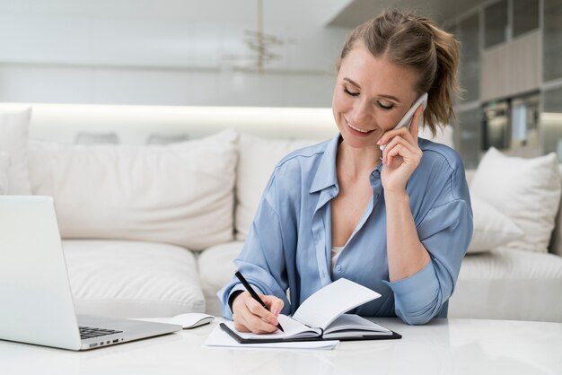 Businesswoman writing with pen