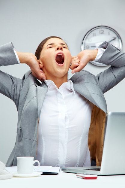 Businesswoman yawning in the office