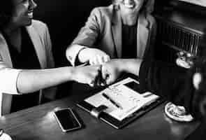 Free photo businesswomen in a fist bump