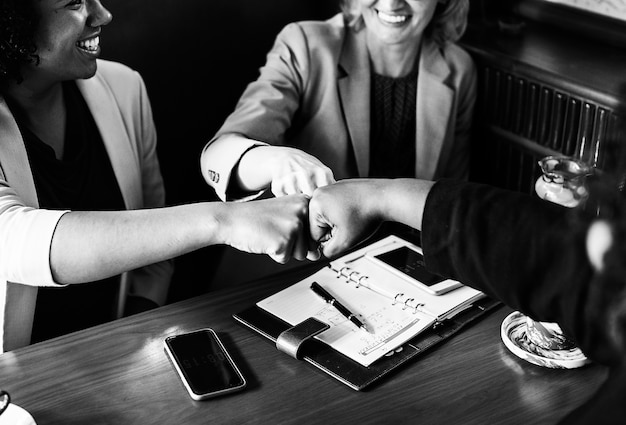 Businesswomen in a fist bump