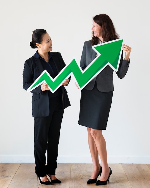 Free photo businesswomen holding profit statistics icon