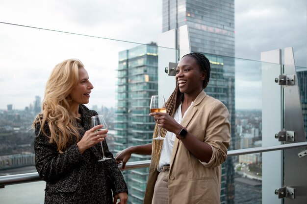 Businesswomen meeting outdoors for drinks