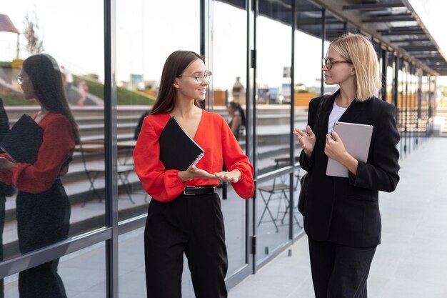 Businesswomen using sign language outdoors