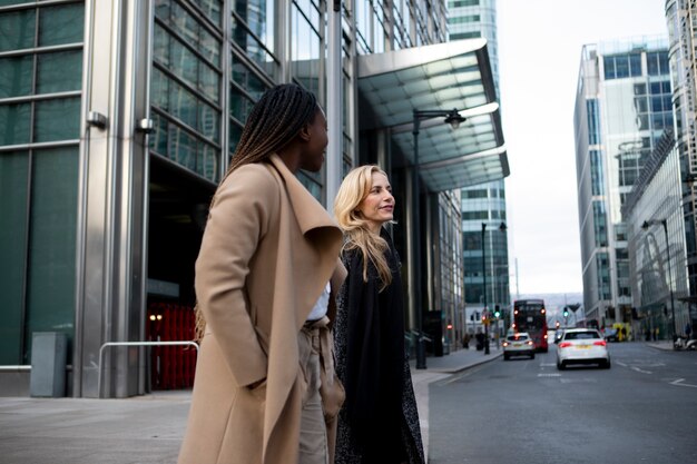 businesswomen walking together to the work place