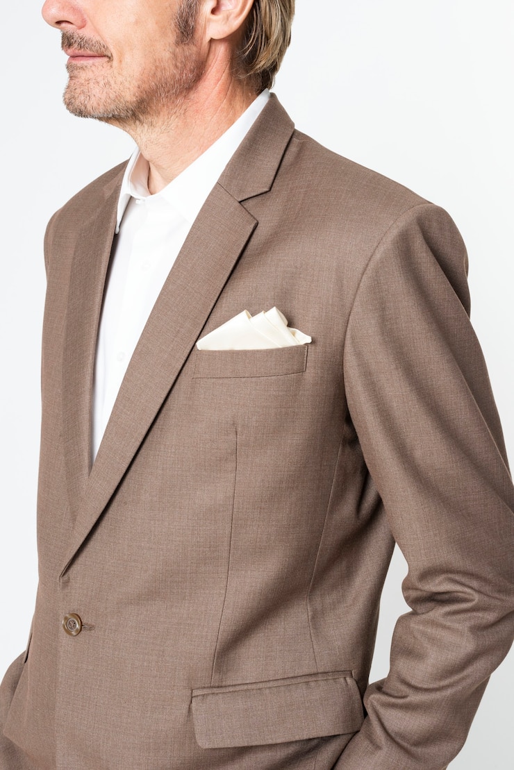 Free Photo bussinessman in brown suit studio portrait