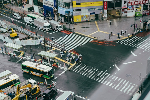 Busy crosswalk in the city with traffic