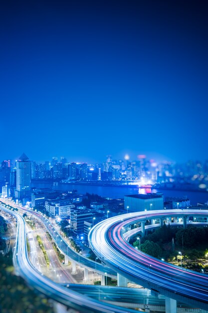 Busy highway traffic light trails at night