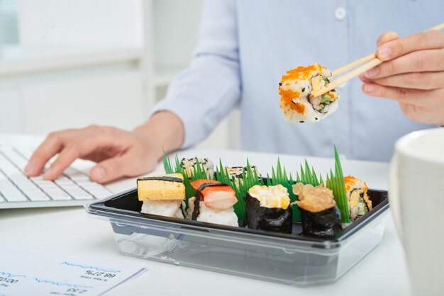 Busy Office Worker Taking Snack