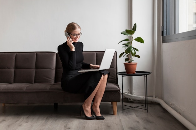 Busy woman talking over phone