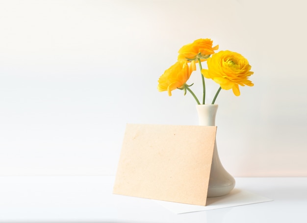 Buttercup flowers in vase.