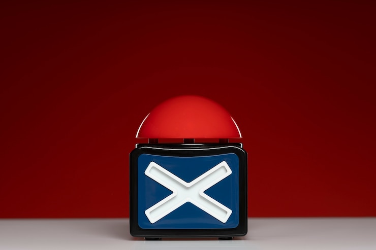Free Photo buzzer with symbol and red background